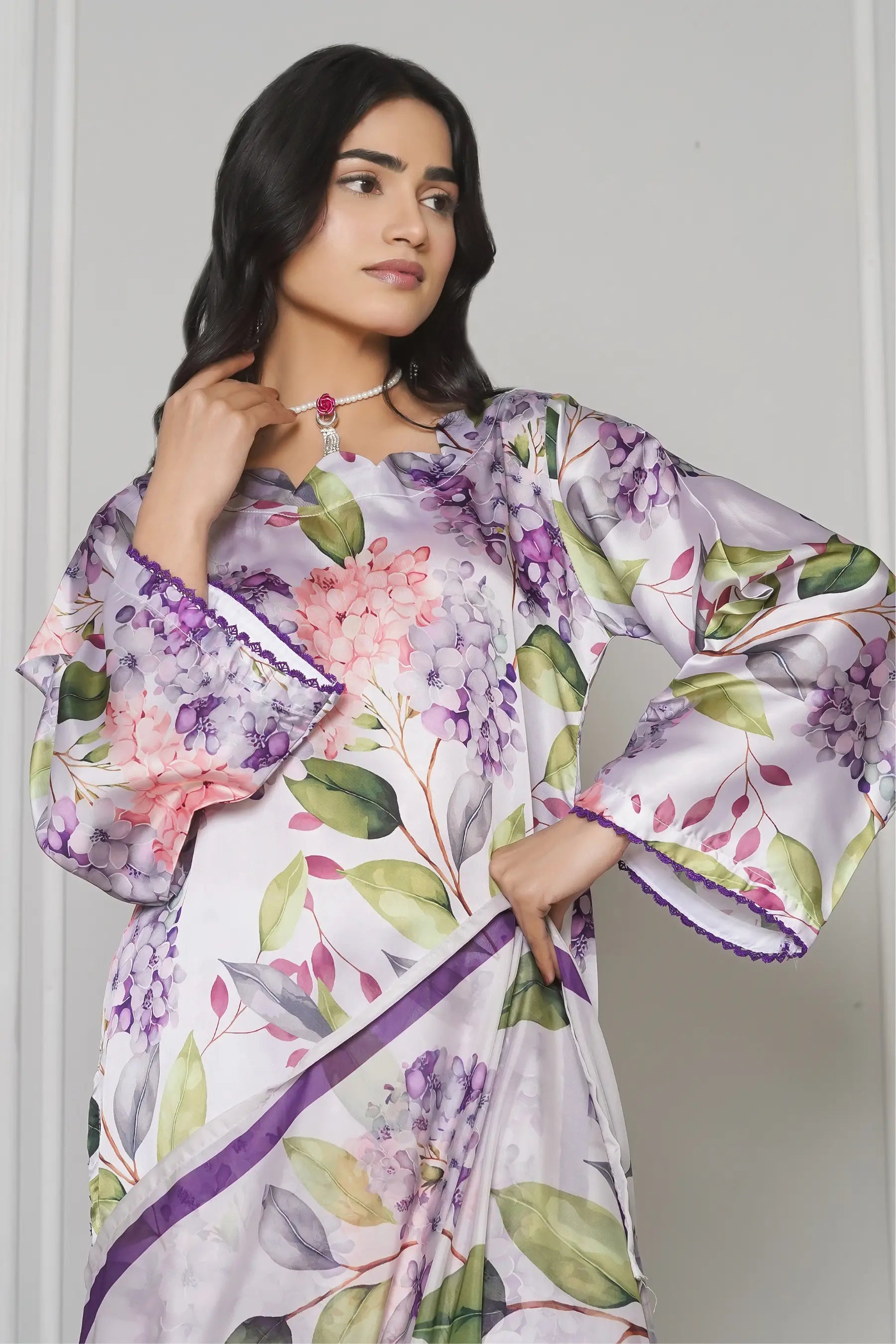 Close-up embroidery work on Lulusar silk suit - premium lace detail on sleeves and chaak